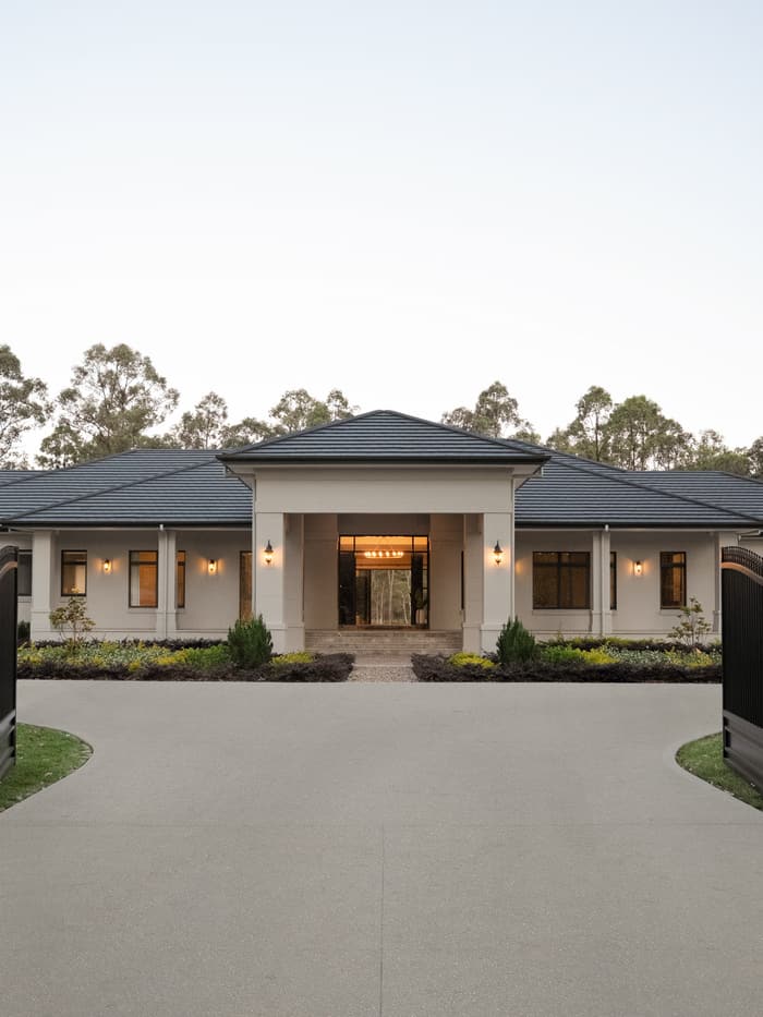 Close view of the front entry portico at dusk